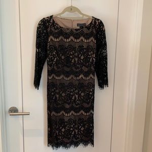 Black lace w/nude lining and sheer lace sleeves.